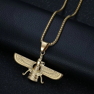 Gold Zoroastrian Faravahar pendant necklace with box chain on black leather background