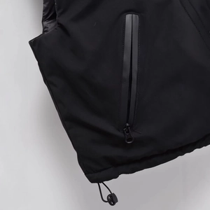 Fashionable black padded vest with waterproof zipper pocket and adjustable drawstring hem