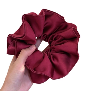 Elegant wine red satin oversized scrunchie for women's low bun hairstyles