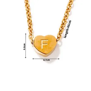 Detail of gold heart pendant with letter F engraving and 45cm O-chain dimensions