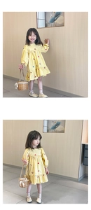 Détails de la robe jaune à manches longues pour bébé avec motif cerise et volants