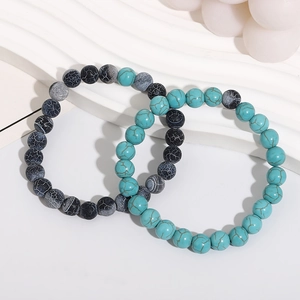 Minimalist natural stone bead bracelets in turquoise and black crackle patterns