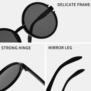 Übergroße Retro-Sonnenbrille mit rundem schwarzen Rahmen und robusten Scharnieren