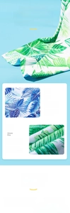 Detail of high-absorbent quick-dry beach towel with tropical green palm leaf print