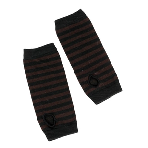 Detail of knit striped fingerless arm warmers in dark brown and black pattern