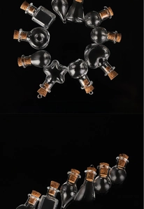 Detailed view of various mini DIY glass bottles with cork stoppers in star and heart shapes