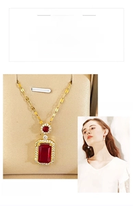 Detail of a square red gemstone pendant with zircon halo on a gold titanium chain