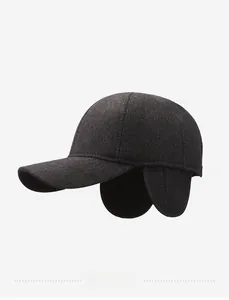 Detail view of winter baseball cap featuring metal Sports Style tag and warm ear flaps