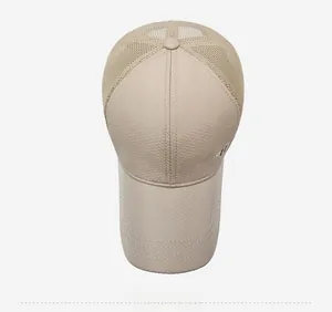 Top view of beige mesh baseball cap showing breathable honeycomb fabric and sport detail