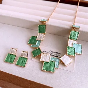 Vintage style square enamel jewelry set with gold necklace and matching stud earrings