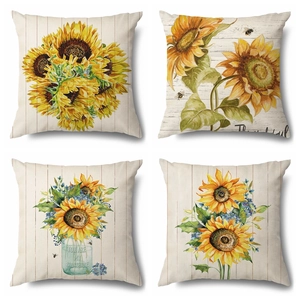 Set of 4 sunflower linen pillow covers with watercolor patterns and wood background