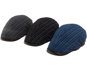 Detail of retro newsboy caps with striped fabric, PU leather brim and metal side buckles