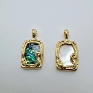 Detail view of 18K gold plated rectangular pendants with abalone and mother of pearl