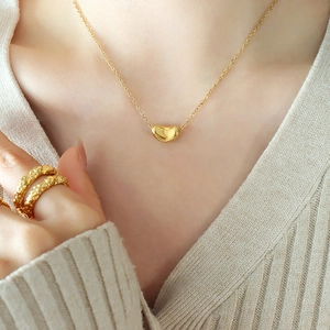 Minimalist gold bean pendant necklace for women with elegant fine chain jewelry style