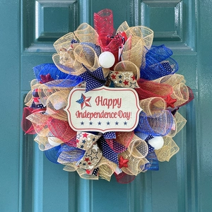 Patriotic USA Independence Day wreath with red blue mesh stars and Happy Holiday sign