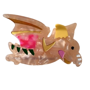 Pince à cheveux dinosaure en acétate rose avec motifs colorés et accents dorés