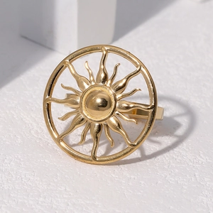 Polished gold sunburst star ring in stainless steel for women with hollow sun design