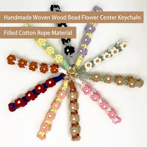 Handmade woven cotton flower keychain set with wooden beads in various vibrant colors