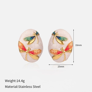 Detail of gold-plated stainless steel oval dragonfly earrings with size and weight specs