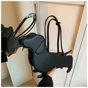 Detailed view of creative dachshund shaped shoulder bag in black faux leather finish