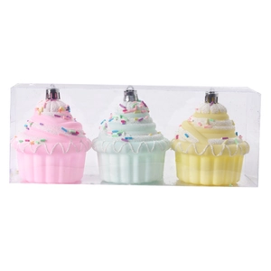 Set of three colorful cupcake Christmas ornaments in pink blue and yellow pastel colors