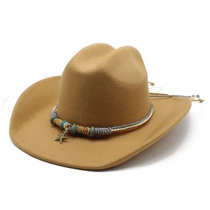 Camel wool western cowboy hat with braided cord and starfish charm on plain background