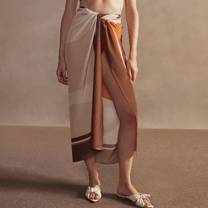 Silky satin sarong with geometric print in beige and orange for a luxury beach look