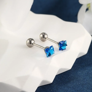 Detail of square blue gemstone earrings with secure screw back ball on white stone stand