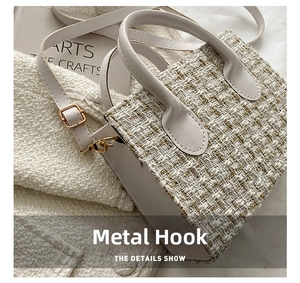 Close-up of elegant white tweed handbag featuring refined gold hardware and leather handle