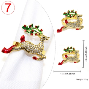 Detail of reindeer napkin ring with rhinestones and enamel on white napkin