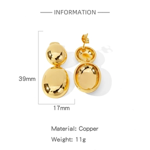 Detail view of 39mm golden double oval earrings made of polished copper weighing 11g