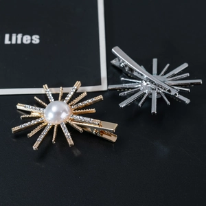 Detail of sunflower hair clip with pearls and rhinestones on high-quality metal base