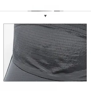 Detail of grey quick-dry baseball cap with SDR logo and ripstop fabric texture