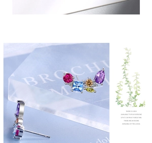 Detailed macro view of colorful zircon stud earrings with S925 silver hallmarks