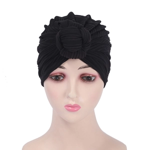 Women's black knitted turban hat with front twist knot design and pleated texture