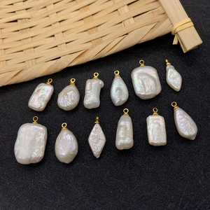 Baroque natural freshwater pearl pendants in irregular shapes with gold metal loop