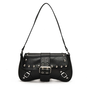 Chic black punk style shoulder bag with silver rivets and studs on a white background