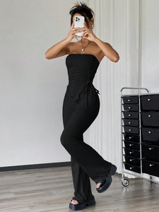 Sexy black two-piece set with drawstring tube top and high waist flared trousers for women
