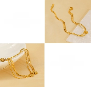 Detail macro view of double-layer gold Figaro chain with daisy pendant in titanium steel