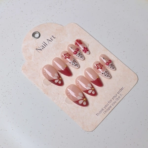 Long almond press-on nails set with cherry designs, leopard prints and 3D floral details