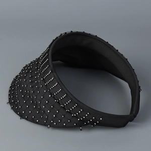 Detail of black sun visor with sparkling rhinestones and mesh overlay for women