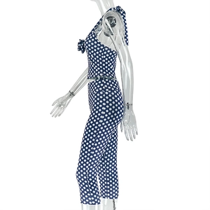 Detail of blue and white polka dot two-piece sport set with halter top and leggings