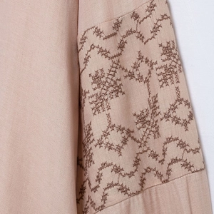 Women's vintage V-neck blouse with brown geometric embroidery on beige cotton-linen sleeves