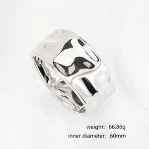 Detail of silver irregular hammered wide cuff bracelet with 60mm diameter and 66g weight