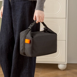 Japanese style insulated lunch bag in black with adjustable buckle handle and side label