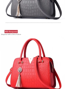 Detail of crocodile-textured handbags with V-shaped metal buckle and tassel pendant