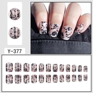 Short pink gradient press-on nails with black flower patterns and model view, set of 24