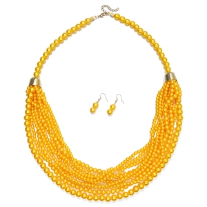 Detail of multi-layer yellow faux pearl tassel necklace set with matching earrings