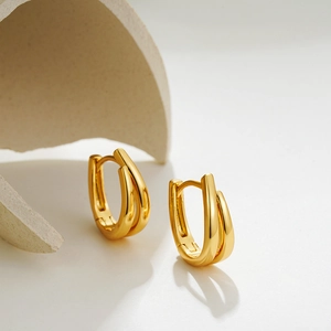 Minimalist 18K gold U-shaped double hoop earrings with a polished geometric finish