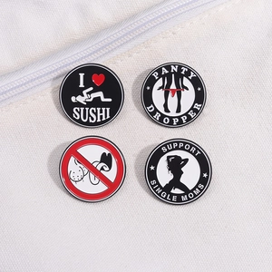 Set of four round metal enamel pins with humorous designs on white canvas background